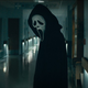 Scream villain Ghostface standing in a hospital.